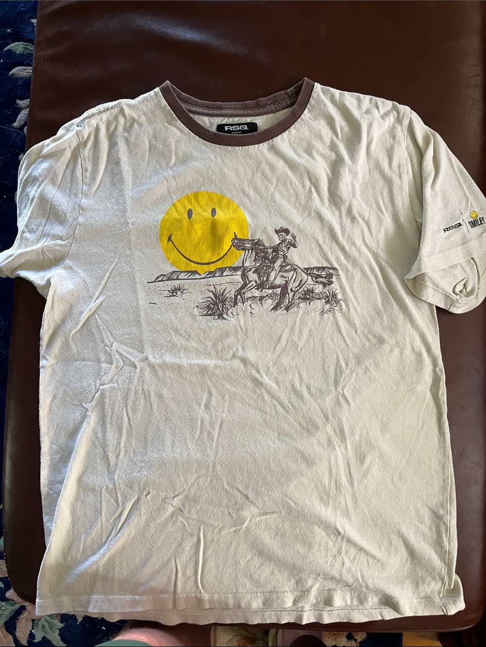 RSQ Men's Cream Tee with Yellow Smiley Cowboy Graphic